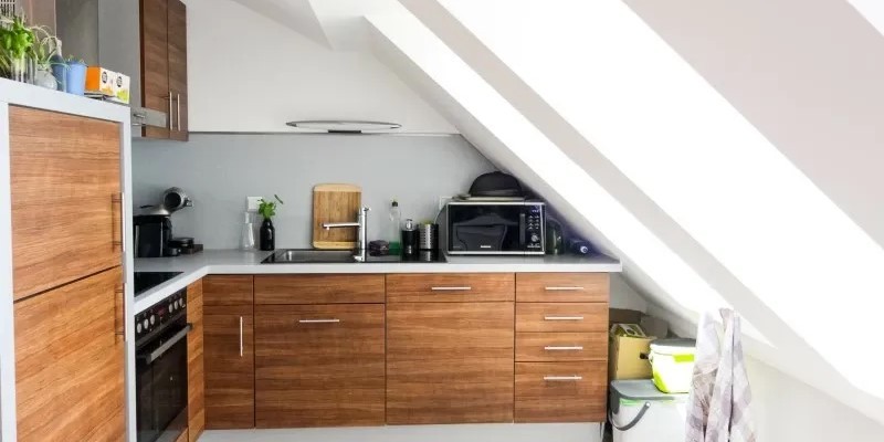 Kitchen in loft with large roof windows