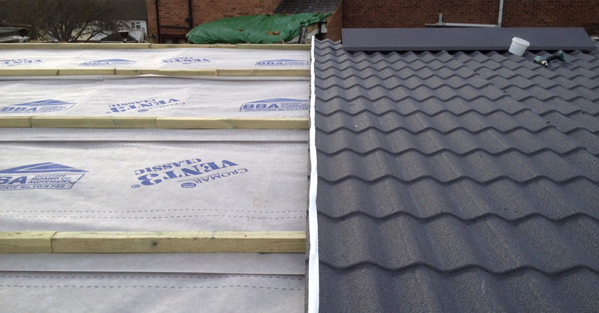 Metal tile effect sheets being used on garage roof replacement.