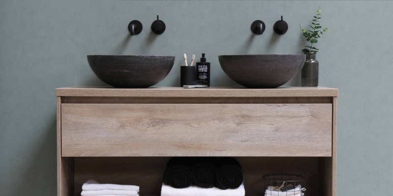 ceramic bowls on wooden bathroom counter