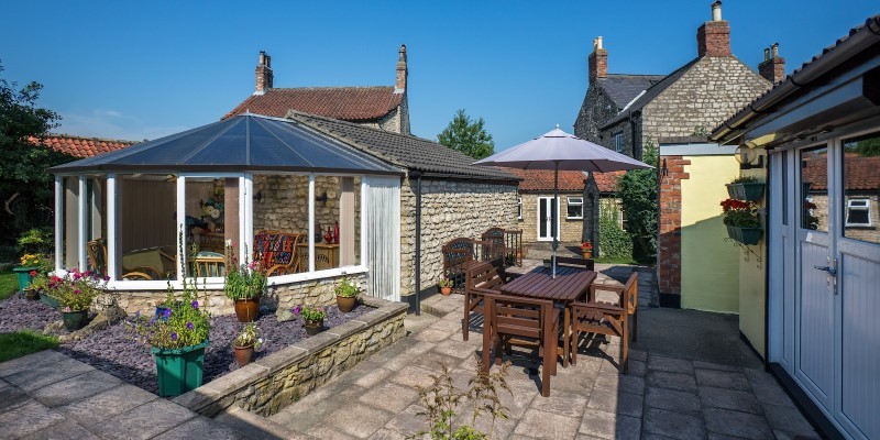 patio and conservatory in a village property